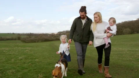 Family On Winter Country Walk With Pet Dog Shot On R3D Stock Footage