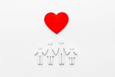 Family wooden figure and heart shape. Life insurance concept Stock Photos