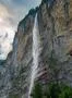 Famous alps waterfall at Lauterbrunnen steep wall mountain Switzerlan Photo