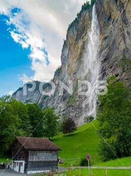 Famous alps waterfall at Lauterbrunnen Switzerland at beautiful sunny summer day Stock Photos