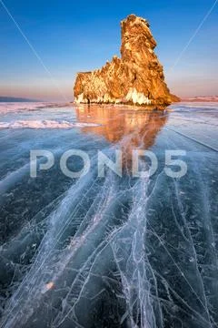 Famous Baikal Lake Ice and Island Ogoy at Sunset, Baikal Lake, Russia Stock Photos