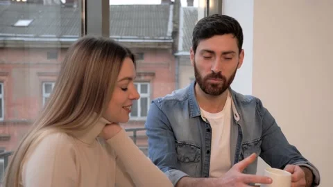 Famous bloggers using laptop computer working together in caffe. Stock Footage 145483501