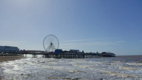 The famous central pier by Blackpool Tower and seaside Stock Footage 105734390