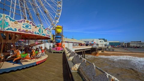 The famous central pier by Blackpool Tower and seaside Stock Footage 106068292