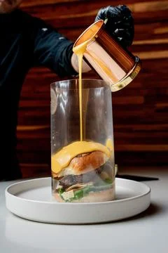 Famous cheeseburger with nacho cheese Stock Photos