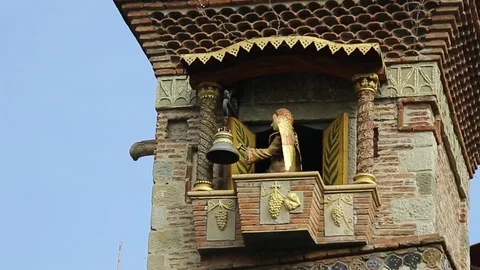 Famous clock tower in Tbilisi showing little performance about circle of life Stock Footage 99501448