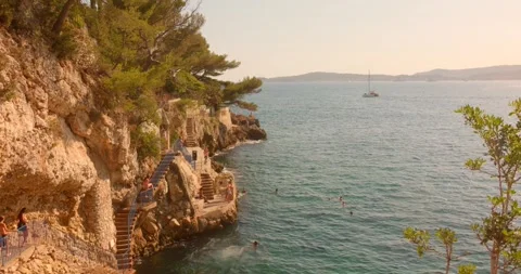 The famous coastal path at Cap d'Ail on the French Riviera in southern France Stock Footage 344257489
