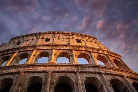 Famous Coliseum Colosseum of Rome at early sunset Stock Photos