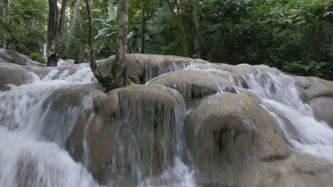 Famous Dunn's River Falls, Jamaica, aerial dolly over waterfalls Stock Footage