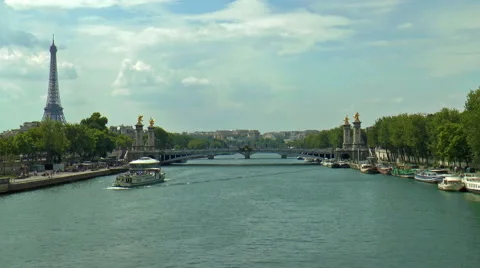 Famous Eiffel Tower and Alexander III bridge over Seine river, Paris, France Stock Footage 46808336