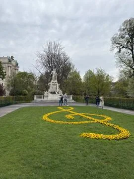 Famous flowerbed in the shape of a treble clef in front of the Mozart Monumen Stock Photos