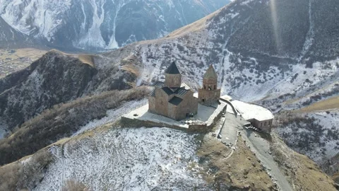 Famous Gergeti Trinity Tsminda Sameba Church In Early Winter Landscape Stock Footage 165623814