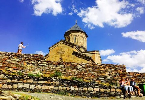 Famous Gergeti Trinity Tsminda Sameba Church. Ancient old georgian church Stock Photos