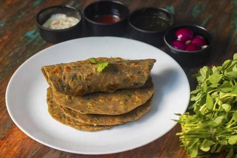 Famous Indian flat bread "Methi Paratha".Made of fenugreek leaf and flour. Stock Photos