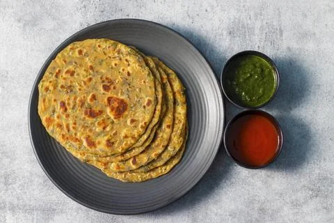 Famous Indian flat bread "Methi Paratha".Made of fenugreek leaf and flour. Stock Photos