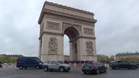 Famous landmark Arc de Triomphe with city traffic Stock Footage 342185693