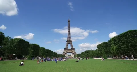 Famous landmark of Paris - Eiffel tower, Champ de mars, Paris, France.Summer day Stock Footage 200398612