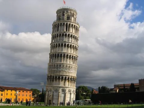 The famous leaning tower in pisa on cloudy sky background Stock Photos