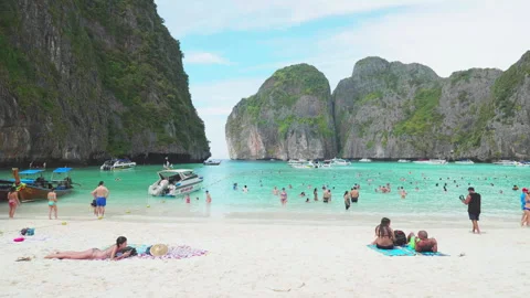 The famous Maya Bay on Phi Phi Islands full of tourists from all over the world Stock Footage 305104910