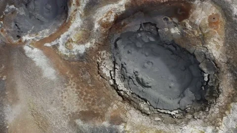 Famous mud pools with gurgling boiling bubbles from underground heat source Stock Footage 145837375