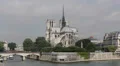Famous Notre Dame Tour Boat passing Seine River Paris France Ship Moving French HD Footage