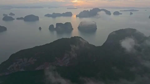 Famous Phang Nga cliffs and clouds glow at dawn, Thailand Video stock 310165111
