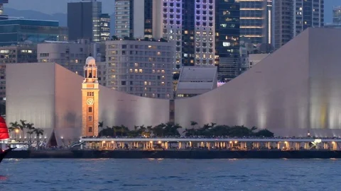 The famous red junk sails past the clock tower, Hong Kong, China. Stock Footage 106185922