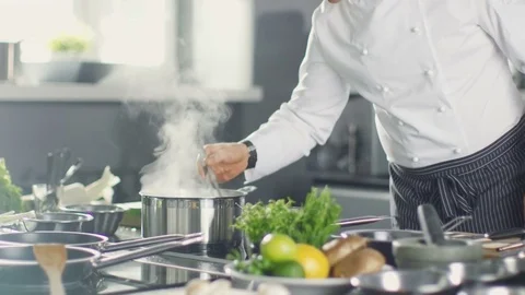 Famous Restaurant Chef Stirs Soup or Sauce in a  Saucepan.  Stock Footage 77020946