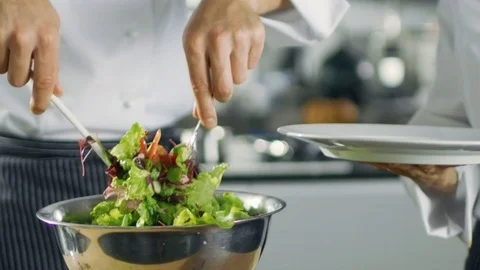In a Famous Restaurant Cook Prepares Salad and Puts it on a Plate.  Stock Footage