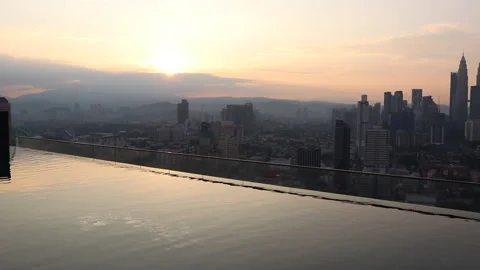 Famous rooftop infinity pool in Kuala Lumpur with view towards Twin Towers 스톡 동영상 157469178