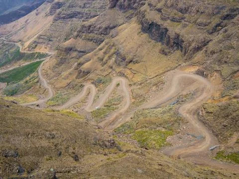 The famous Sani mountain pass dirt road with many tight curves connecting Stock Photos