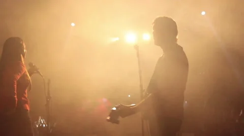 A famous singer performing live. All the lights are blinking upon him Stock Footage 54263476