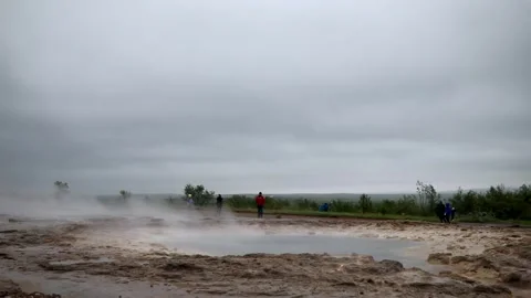 Famous Strokkur geyser between eruptions on a foggy rainy day in Iceland Stock Footage 298571125