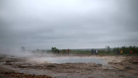 Famous Strokkur geyser between eruptions on a foggy rainy day in Iceland Stock Footage 298571689