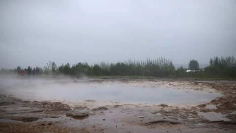 Famous Strokkur geyser between eruptions on a foggy rainy day in Iceland Stock Footage 301251415