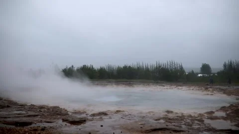 Famous Strokkur geyser between eruptions on a foggy rainy day in Iceland Stock Footage 301251424