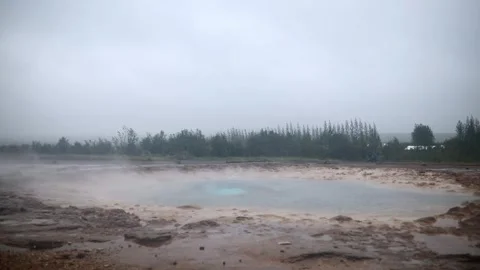 Famous Strokkur geyser between eruptions on a foggy rainy day in Iceland Stock Footage 301251426