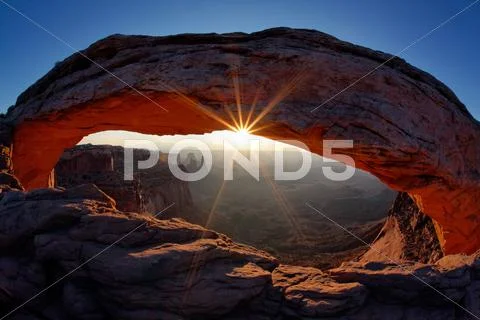 Famous sunrise at mesa arch Stock Photos