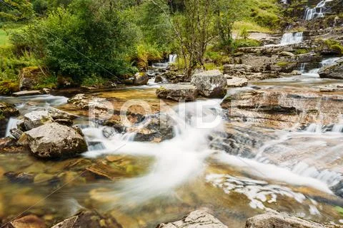 Famous Tvindefossen Waterfall In Norway. Amazing And Beautiful V Stock Photos