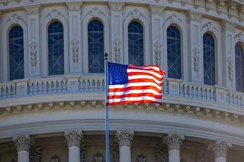 Famous Washington DC with American flag. USA Flag near US Capitol. American f Stock Photos