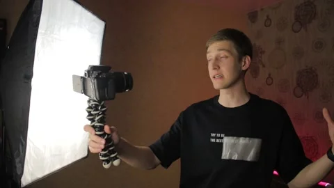 Famous young influencer excited while talking with the camera. Recording new Stock Footage 148084277