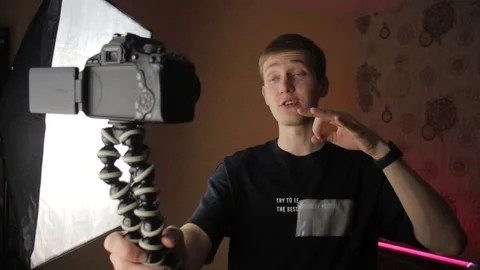Famous young influencer excited while talking with the camera. Recording new Stock Footage 148084531