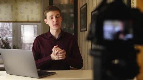 Famous young influencer excited while talking with the camera. Recording new Stock Footage 148084689