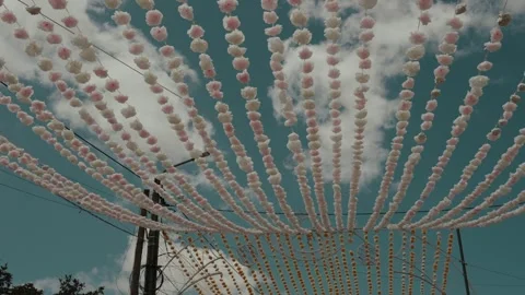 Fan of Beaded Garlands Strung Over Street Pole at Portuguese Festival Stock Footage 340225367