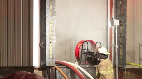 Fan Blowing Smoke into Building Video stock 45652196
