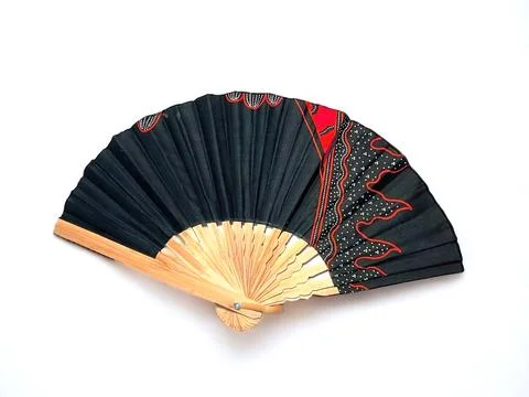 Fan of handmade abstract pattern on the fabric on a white background Stock Photos