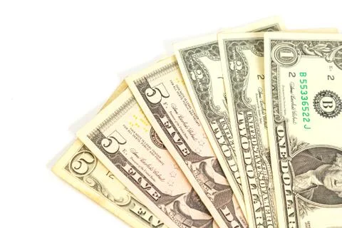 A fan of one two and five dollar bills on a white background. isolate. close up Stock Photos