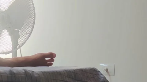 A fan Rotating From Side to Side Blows the Wind. Electric Cooling Fan.  Stock Footage 204838573