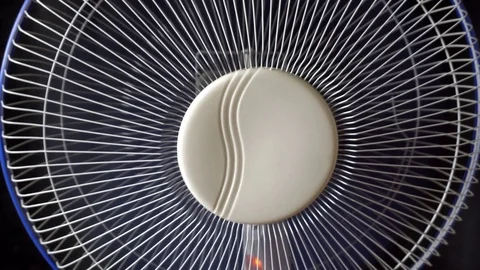 The fan is spinning on black background Video stock 76781180