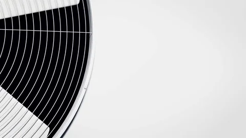 The fan is on a white wall. Vídeo Stock 85099012